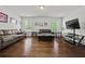 Spacious living room with hardwood floors, lots of natural light, and stylish decor at 2015 Chapel Estates Lane Southeast Ln, Dacula, GA 30019