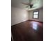 Empty bedroom with a window and hardwood floors at 2169 Tiffany Ln, Lithonia, GA 30058