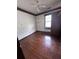 Bedroom with wood floors and a ceiling fan and a bright window at 2169 Tiffany Ln, Lithonia, GA 30058