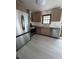 Galley kitchen with stainless steel appliances and wooden cabinets at 2169 Tiffany Ln, Lithonia, GA 30058