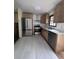 Kitchen featuring stainless steel appliances, light countertops, and wood cabinets at 2169 Tiffany Ln, Lithonia, GA 30058