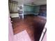 Open-concept living area with hardwood floors, fireplace and abundant light at 2169 Tiffany Ln, Lithonia, GA 30058