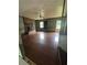 Hardwood floors in a living room with a brick fireplace and green walls at 2169 Tiffany Ln, Lithonia, GA 30058