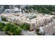Aerial view showcasing the building's architecture, balconies, and surrounding lush greenery at 390 17Th Nw St # 4031, Atlanta, GA 30363