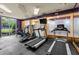 Bright workout room showcasing treadmills, ellipticals, and scenic outdoor views at 390 17Th Nw St # 4031, Atlanta, GA 30363