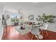 Bright living room with hardwood floors, neutral decor, and a large window showcasing exterior greenery at 390 17Th Nw St # 4031, Atlanta, GA 30363