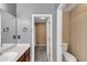 Bathroom featuring neutral walls, single vanity and toilet at 401 Crosshaven Way, Mcdonough, GA 30253