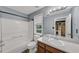 Bathroom with a vanity, toilet, and tub/shower combo, with a window providing natural light at 401 Crosshaven Way, Mcdonough, GA 30253