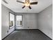 Bedroom featuring neutral walls, ceiling fan, and natural light from the windows at 401 Crosshaven Way, Mcdonough, GA 30253