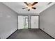 Bedroom with gray walls, fan, and closet doors, offering a calming space at 401 Crosshaven Way, Mcdonough, GA 30253