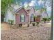 Well-maintained brick home with a side entry garage and lush landscaping, offering a serene and private setting at 401 Crosshaven Way, Mcdonough, GA 30253