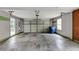 Spacious garage with ample parking space and a large garage door at 401 Crosshaven Way, Mcdonough, GA 30253