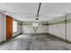 The garage has a large parking space and an overhead light at 401 Crosshaven Way, Mcdonough, GA 30253