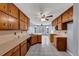 Bright kitchen with wooden cabinets, ample counter space, and tile flooring, with an adjacent breakfast nook at 401 Crosshaven Way, Mcdonough, GA 30253