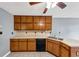 Traditional kitchen with wooden cabinets, laminate countertops, double basin sink, and tile flooring at 401 Crosshaven Way, Mcdonough, GA 30253