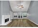 Spacious living room featuring a fireplace, high ceilings, and hardwood floors, offering a comfortable and inviting space at 401 Crosshaven Way, Mcdonough, GA 30253