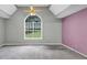 Main bedroom with vaulted ceiling and large window at 401 Crosshaven Way, Mcdonough, GA 30253