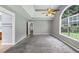 Bright main bedroom with tray ceilings, ample natural light, and ensuite bath at 401 Crosshaven Way, Mcdonough, GA 30253