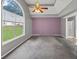 View of the main bedroom featuring a trey ceiling and large window at 401 Crosshaven Way, Mcdonough, GA 30253