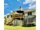 Spacious backyard featuring a deck, storage shed, trampoline and lush lawn at 507 Legacy Park Ln, Powder Springs, GA 30127
