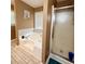 Bathroom with tiled floors offers soaking tub with shower and glass shower stall at 507 Legacy Park Ln, Powder Springs, GA 30127