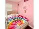 Comfortable bedroom designed with pink walls, teddy bear decor and natural light, perfect for relaxing at 507 Legacy Park Ln, Powder Springs, GA 30127