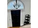 Bright entryway showcasing a black door and decorative shelving, offering a welcoming first impression at 507 Legacy Park Ln, Powder Springs, GA 30127