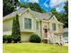 Lovely two-story home featuring light siding, white trim, and lush green lawn at 507 Legacy Park Ln, Powder Springs, GA 30127