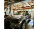 Attached garage showcasing ample space for parking with shelving at 507 Legacy Park Ln, Powder Springs, GA 30127