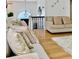Cozy living room featuring plush sofas, wood floors, and soft, neutral decor at 507 Legacy Park Ln, Powder Springs, GA 30127