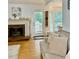 Welcoming living room with a brick fireplace, hardwood floors, and cozy seating at 507 Legacy Park Ln, Powder Springs, GA 30127