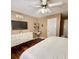 Comfortable main bedroom with hardwood floors, white dresser and modern decor at 507 Legacy Park Ln, Powder Springs, GA 30127