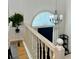 Foyer with staircase showcasing white railings and a decorative chandelier at 507 Legacy Park Ln, Powder Springs, GA 30127