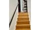 Staircase featuring hardwood steps and modern railing at 507 Legacy Park Ln, Powder Springs, GA 30127