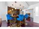 Home bar featuring artistic epoxy floors, pendant lighting, and direct access to a bedroom through a rolling door at 1231 Barnes Nw St, Atlanta, GA 30318