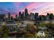Beautiful shot of the city skyline with greenery, tall buildings, and major roadways at dusk at 1231 Barnes Nw St, Atlanta, GA 30318