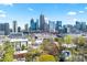 Beautiful shot of the city skyline with greenery, tall buildings, and major roadways in daytime at 1231 Barnes Nw St, Atlanta, GA 30318