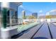 Modern fire table with glass surround provides ambiance on deck with skyline views at 1231 Barnes Nw St, Atlanta, GA 30318