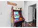 Interior view showcasing a vintage-style arcade game, adding a touch of fun to this unique living space at 1231 Barnes Nw St, Atlanta, GA 30318