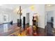 Cozy living room space enhanced by artistic epoxy floors, leading to a staircase and other rooms in the house at 1231 Barnes Nw St, Atlanta, GA 30318