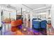 A spacious living room offers a sleek design with eye-catching floor, seating and open floorplan to kitchen and bar at 1231 Barnes Nw St, Atlanta, GA 30318
