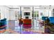 Bright living room featuring fireplace, artistic epoxy floors and large windows overlooking the exterior at 1231 Barnes Nw St, Atlanta, GA 30318