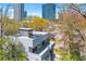 Modern home with a rooftop deck that features stylish outdoor seating and a stunning cityscape view at 1231 Barnes Nw St, Atlanta, GA 30318