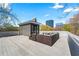 Entertain on this large rooftop deck with city views, complete with stylish seating and a modern design at 1231 Barnes Nw St, Atlanta, GA 30318