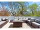 Inviting rooftop deck featuring comfortable lounge seating and a cozy fire table with city views at 1231 Barnes Nw St, Atlanta, GA 30318
