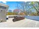 Spacious rooftop deck offers ample seating and a tranquil setting with city skyline in the distance at 1231 Barnes Nw St, Atlanta, GA 30318