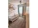 Charming Bedroom featuring floral wallpaper and a white crib, with plenty of space for play at 126 Jacobs Ln, Loganville, GA 30052