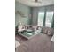 Cozy bedroom with an accent wall, carpeted floors and soft, natural light at 126 Jacobs Ln, Loganville, GA 30052