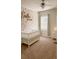 Charming Bedroom featuring floral wallpaper, plush carpet, and a ceiling fan for added comfort at 126 Jacobs Ln, Loganville, GA 30052