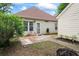 Backyard patio with a lawn and a fire pit at 615 Brookwater Dr, Stockbridge, GA 30281
